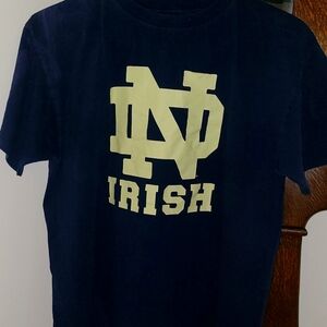 Men's size extra large navy blue with gold decals brand is NCAA